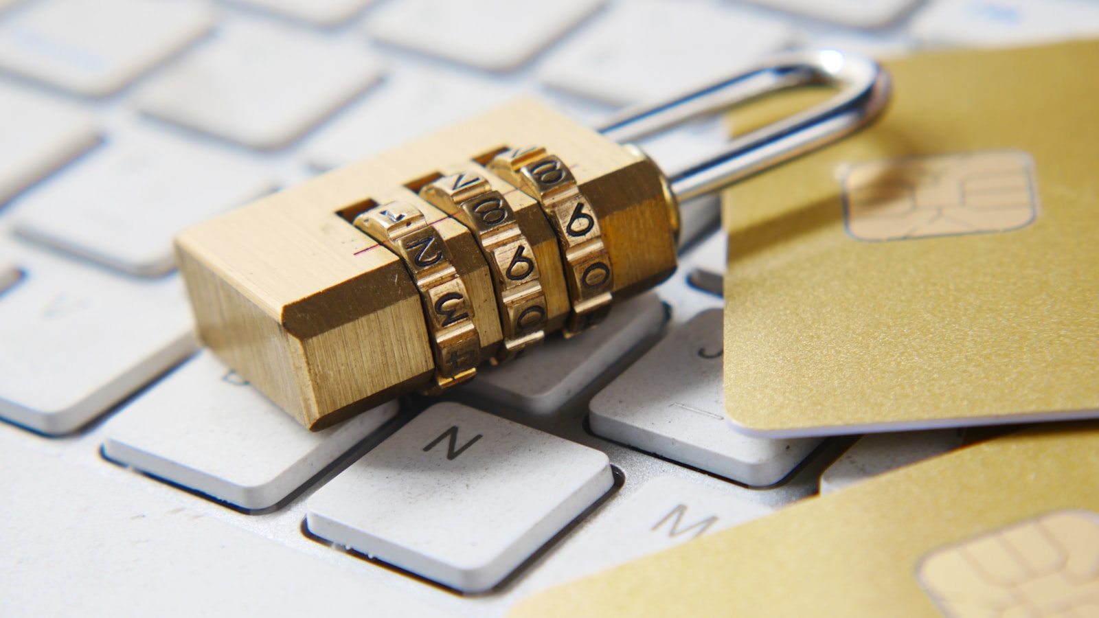 30 cybersecurity a golden padlock sitting on top of a keyboard FnA5pAzqhMM