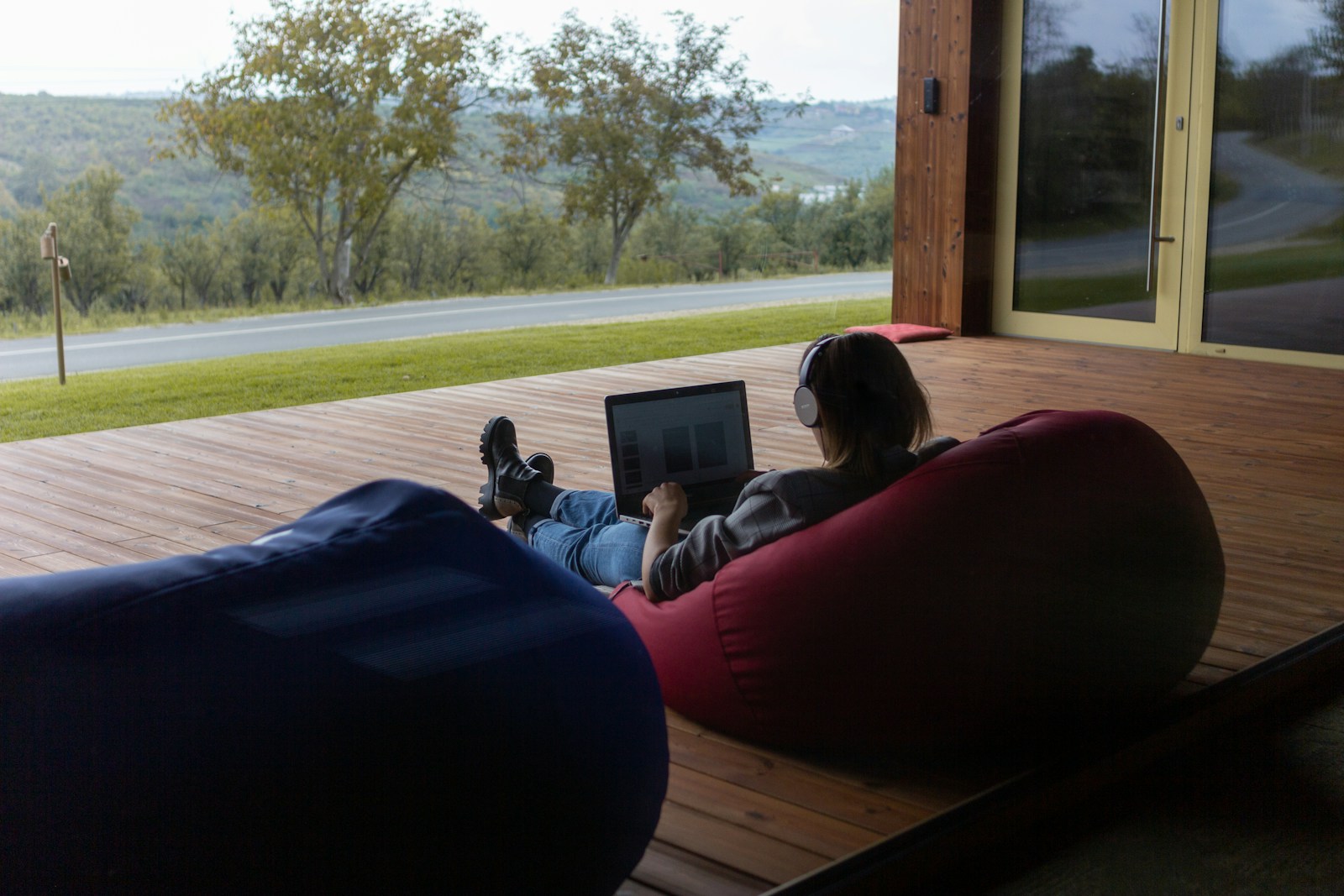 79 remote work a person sitting on a bean bag chair using a laptop zequbbqsh0k